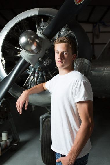 different senior picture with plane